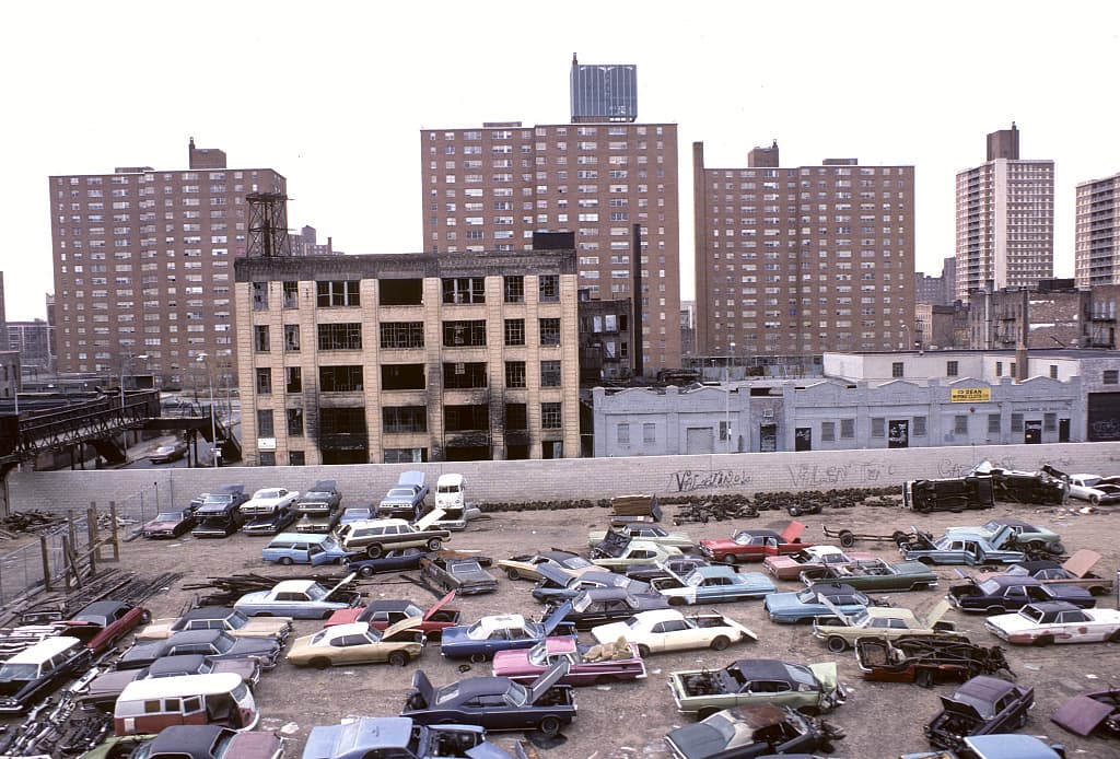 Brownsville in 1978, looking out from the Sutter Avenue stop on the L train, with blocks of tenements whose windows the city had bricked shut after abandonment.