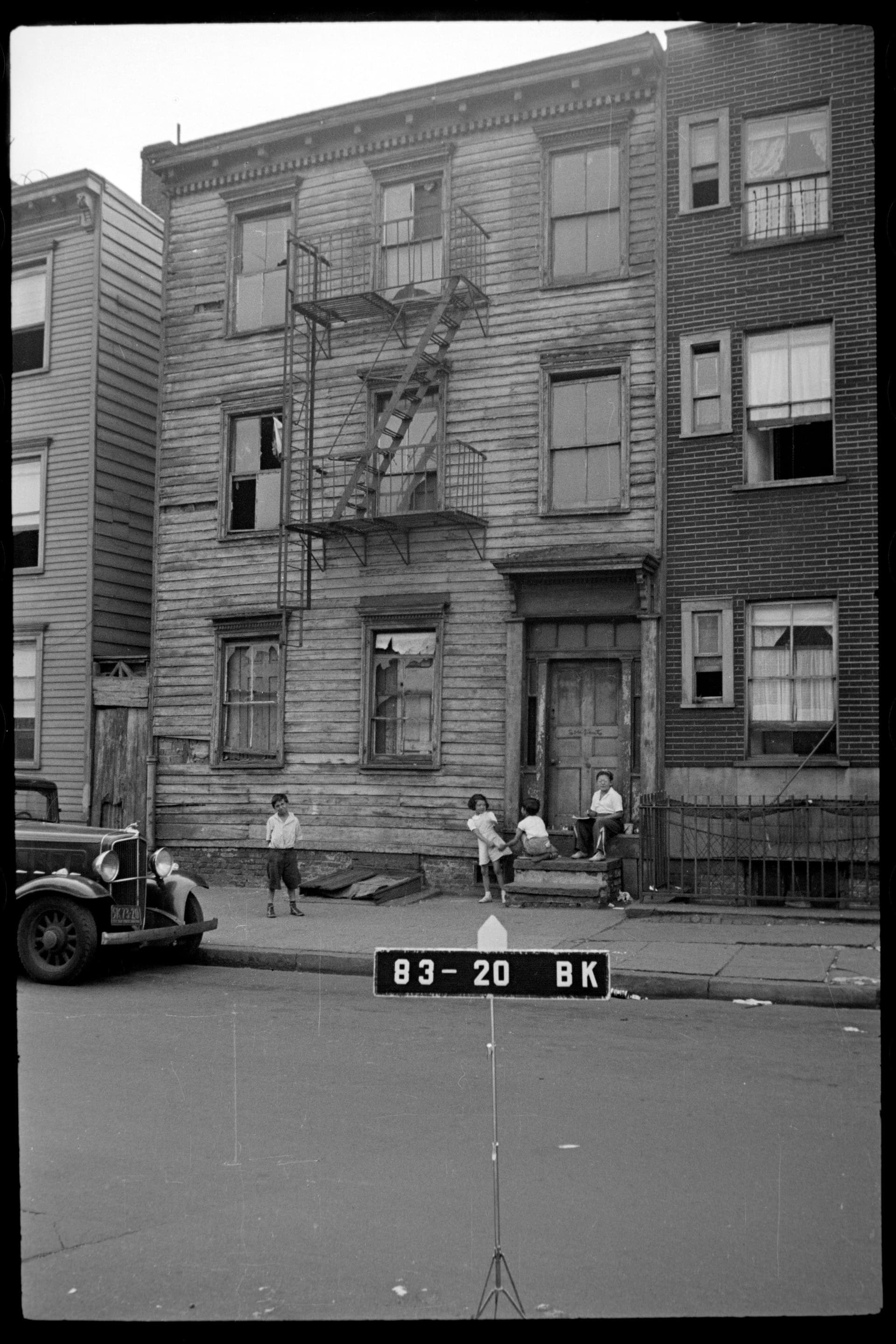 Tenement block on West Sixty-Second Street between Amsterdam Avenue and West End Avenue, photographed by the New York City Department of Taxation in 1940, several years before the Lincoln Square clearance.